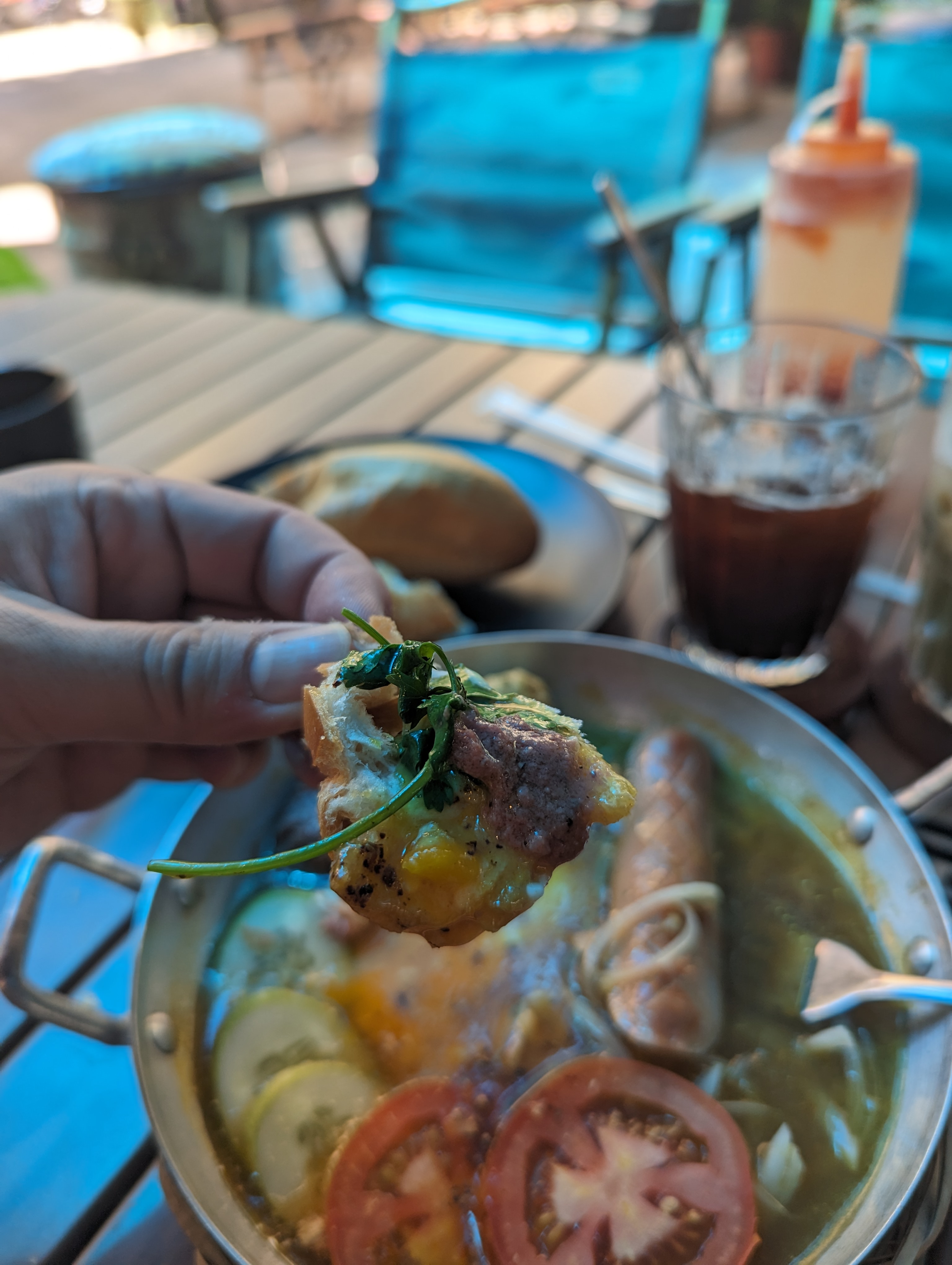 Bánh mì and a hot pot at an outdoor table