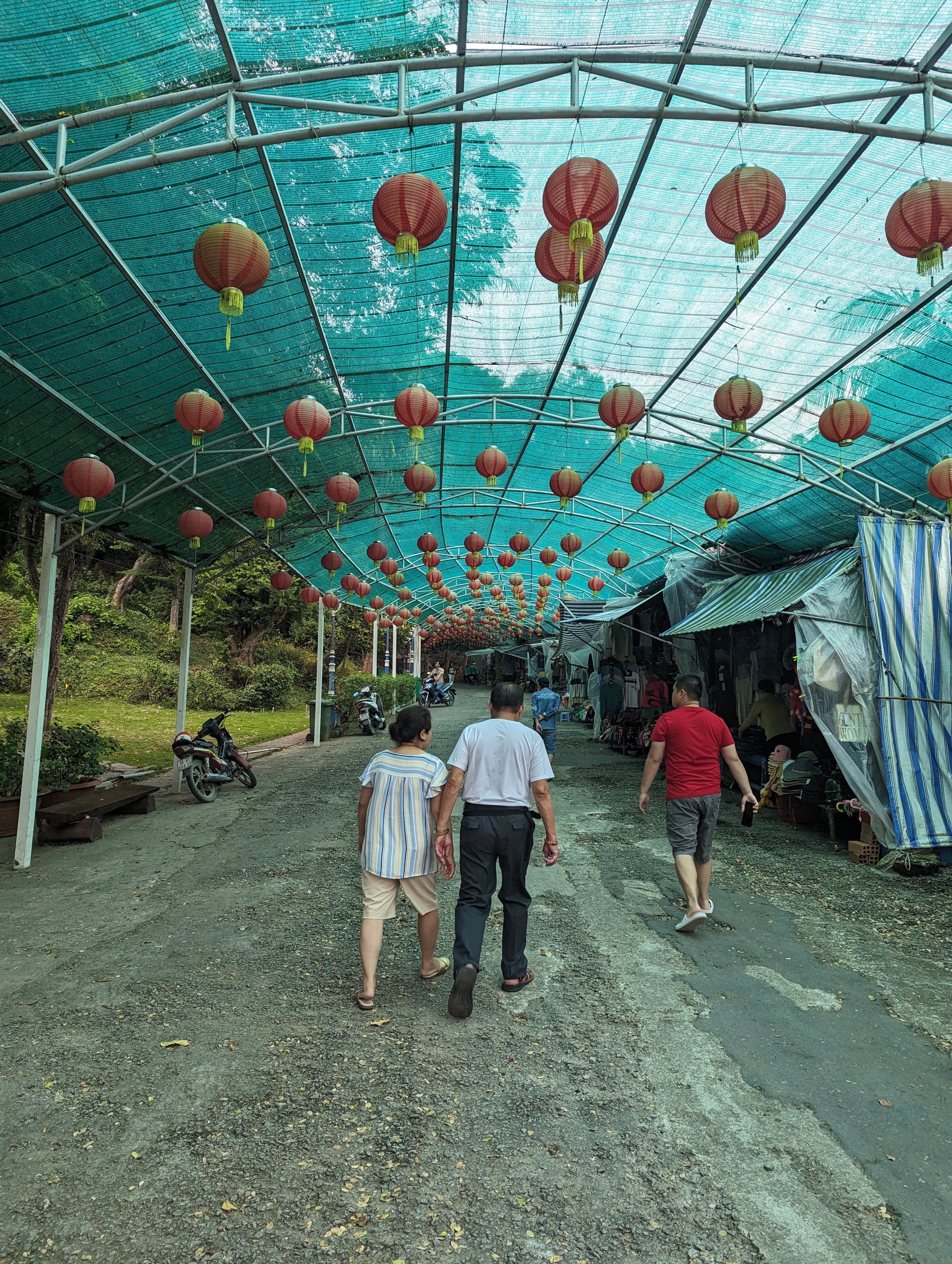 A market lane under hundreds of red lanterns