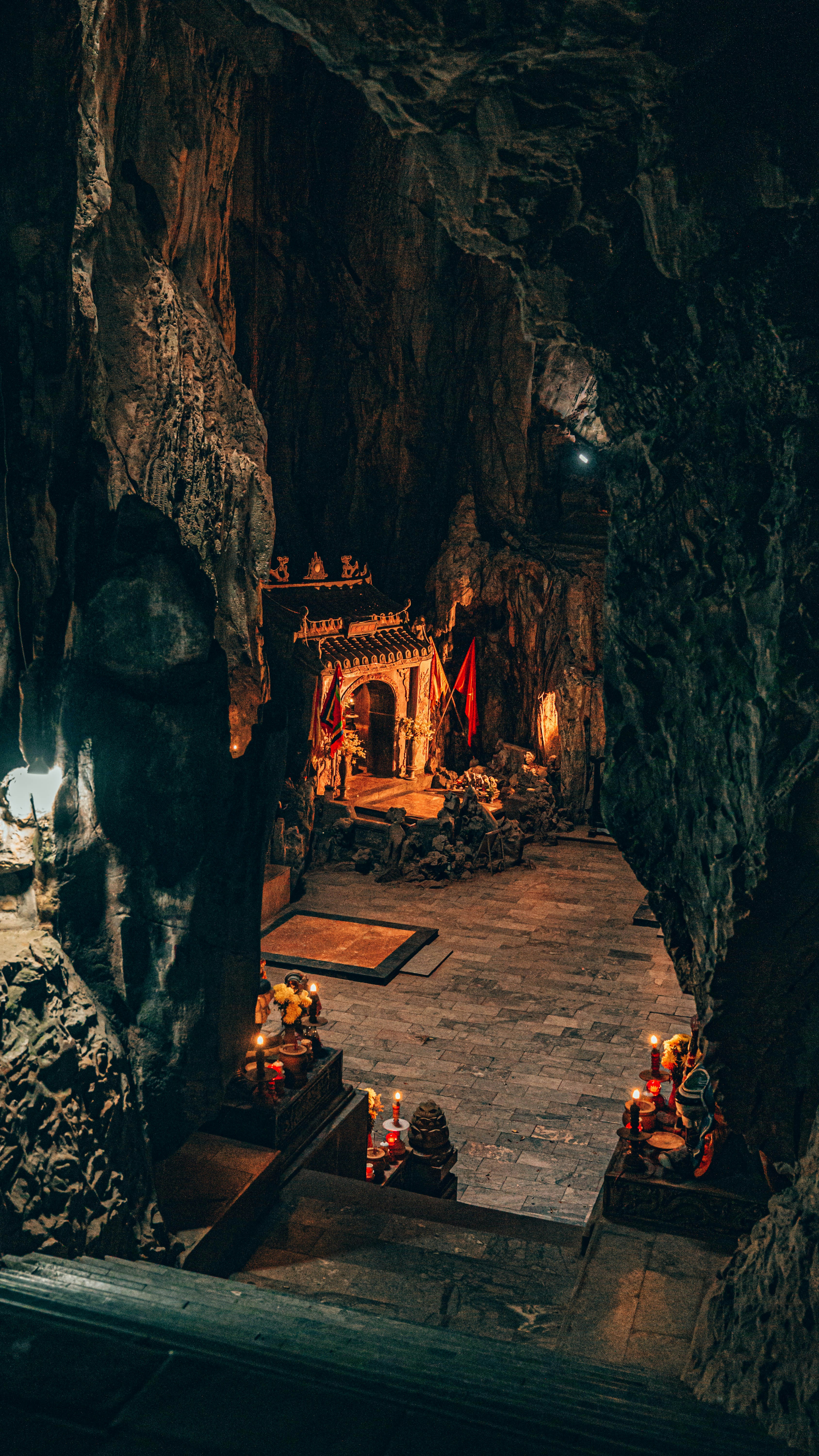 A candlelit shrine inside a Marble Mountain cave