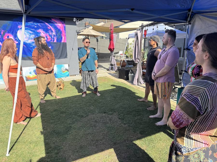 Addressing a group on the mic at an outdoor session