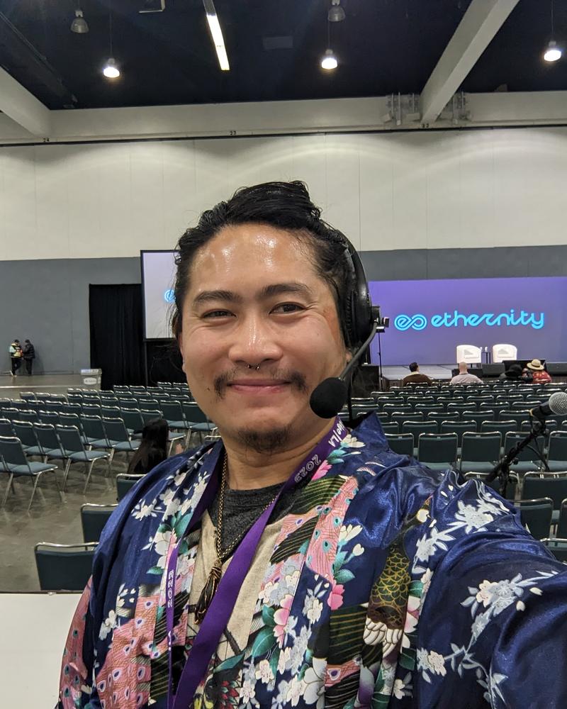 Corporate conference, headset mic, stage behind