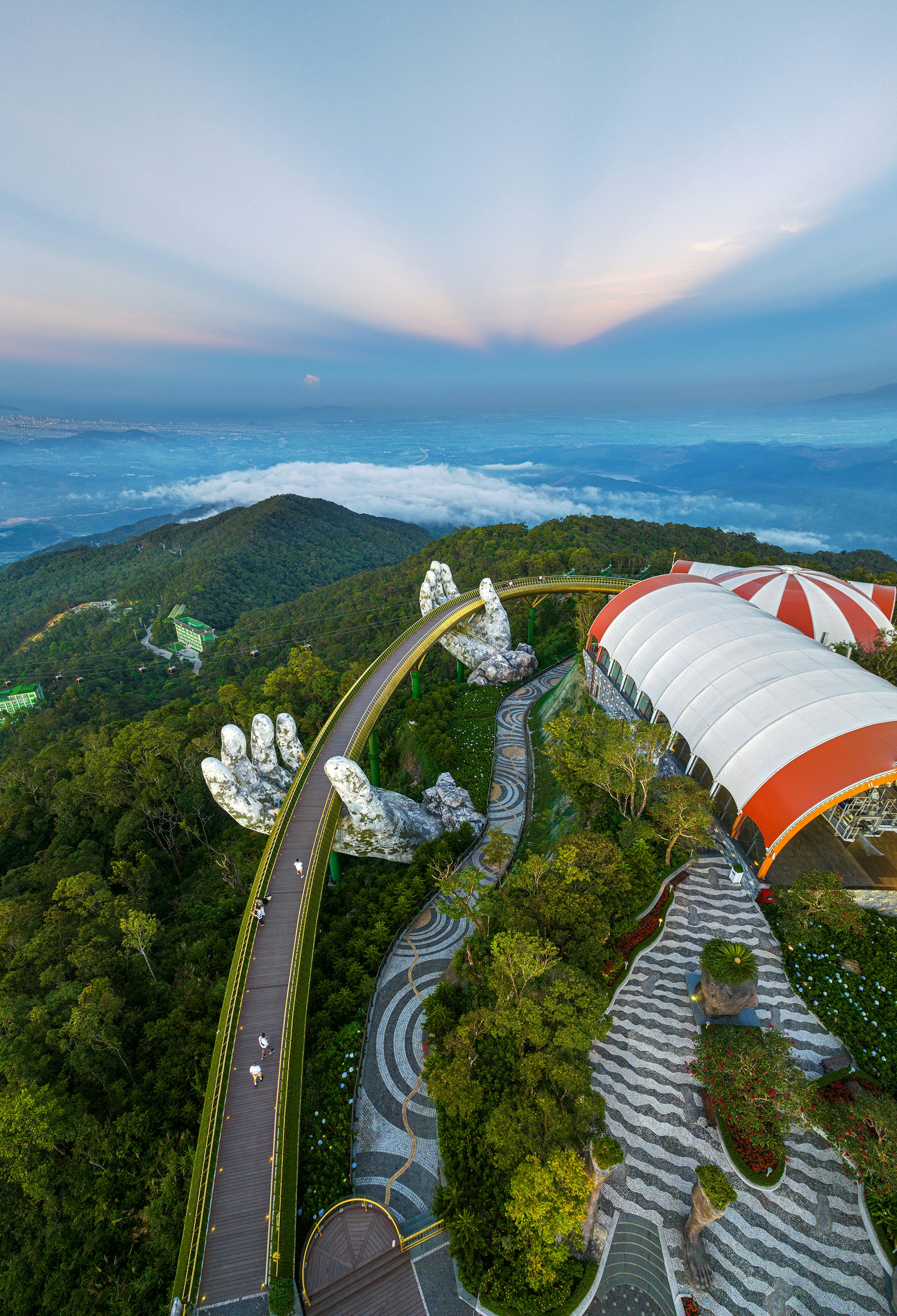 The Ba Nà hills and Golden Bridge above the clouds at dawn